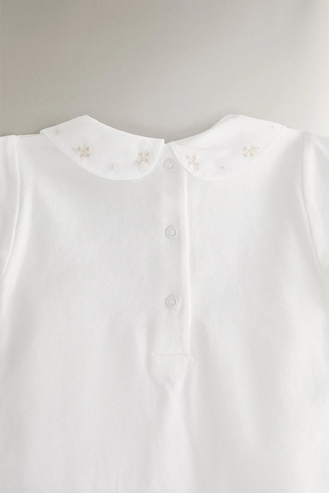 CHILDREN'S BODYSUIT WITH FLORAL EMBROIDERY