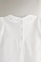 CHILDREN'S BODYSUIT WITH FLORAL EMBROIDERY
