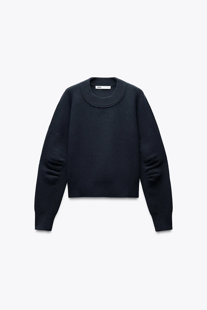 PLEATED SLEEVE SWEATSHIRT