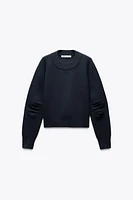 PLEATED SLEEVE SWEATSHIRT