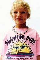 T-SHIRT TEINT EN PIÈCE IMPRIMÉ