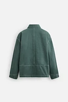 VESTE DÉLAVÉE SURPIQÛRES CONTRASTÉES