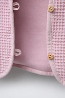 VESTE GAUFRÉE À BOUTONS