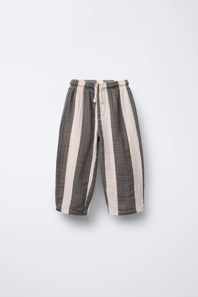 PANTALON EN MATIÈRES VARIÉES À RAYURES