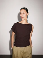 Draped neckline top with brooch detail