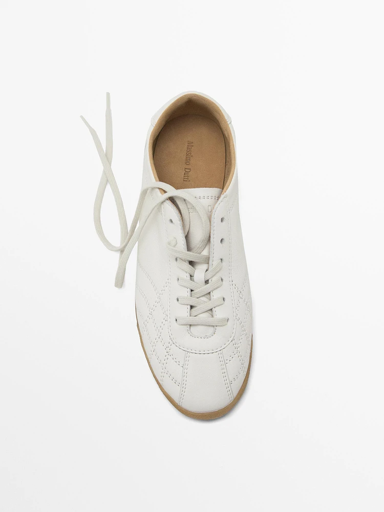 White topstitched trainers