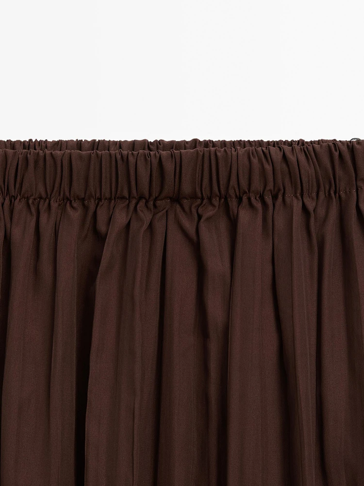 Long flowing pleated skirt