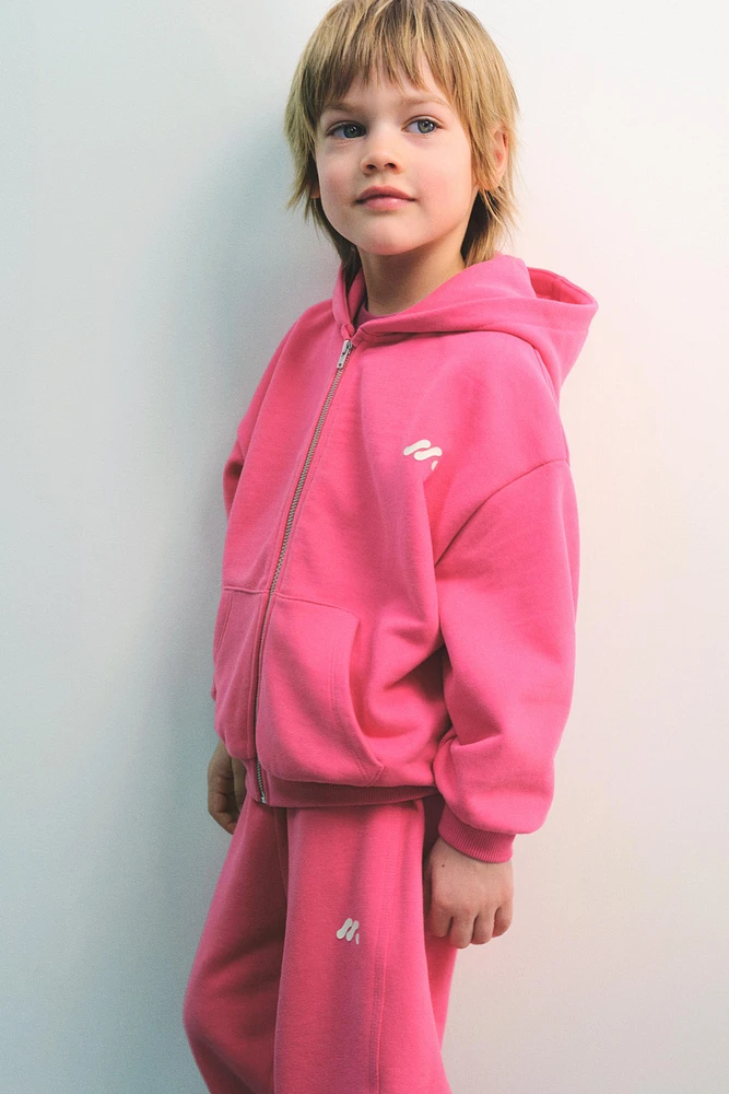 SWEAT À CAPUCHE ET LOGO