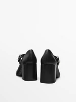 High-heel shoes with buckled strap