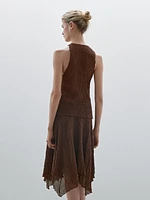 Flowing check skirt with asymmetric hem