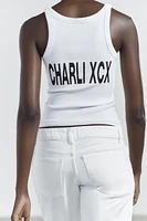 CHARLI XCX© STRAPPY TOP