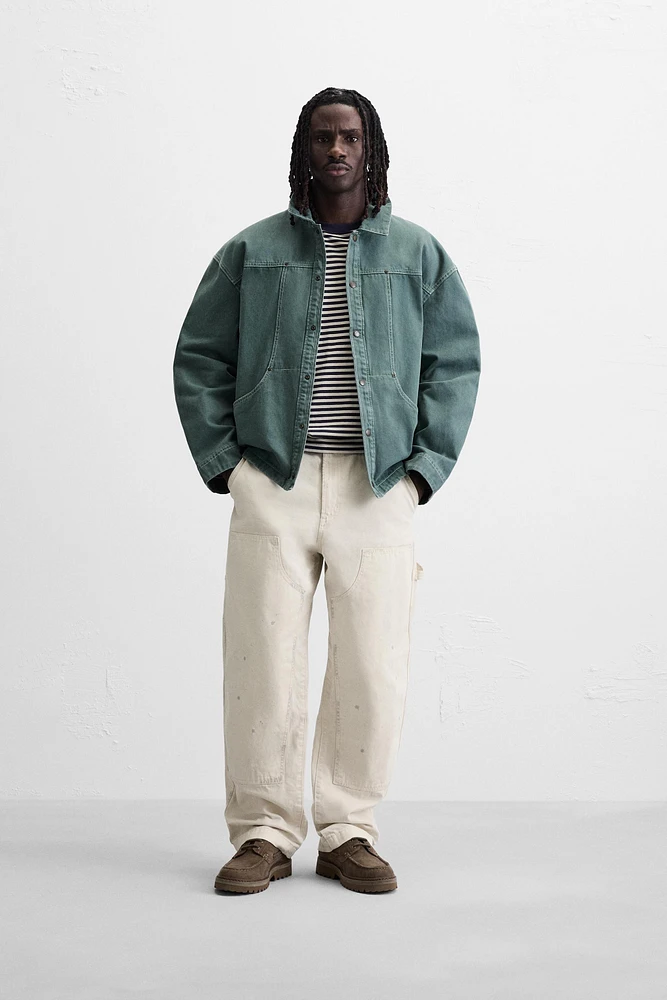 VESTE DÉLAVÉE SURPIQÛRES CONTRASTÉES