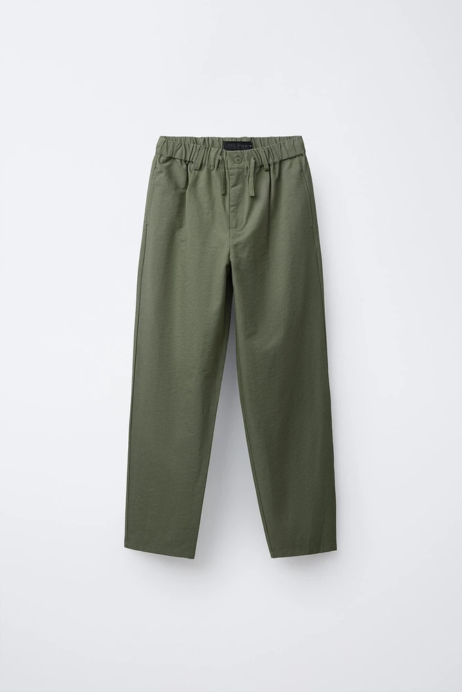 FLOWY PLEATED PANTS