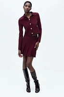 GILET EN MAILLE À BOUTON DORÉ
