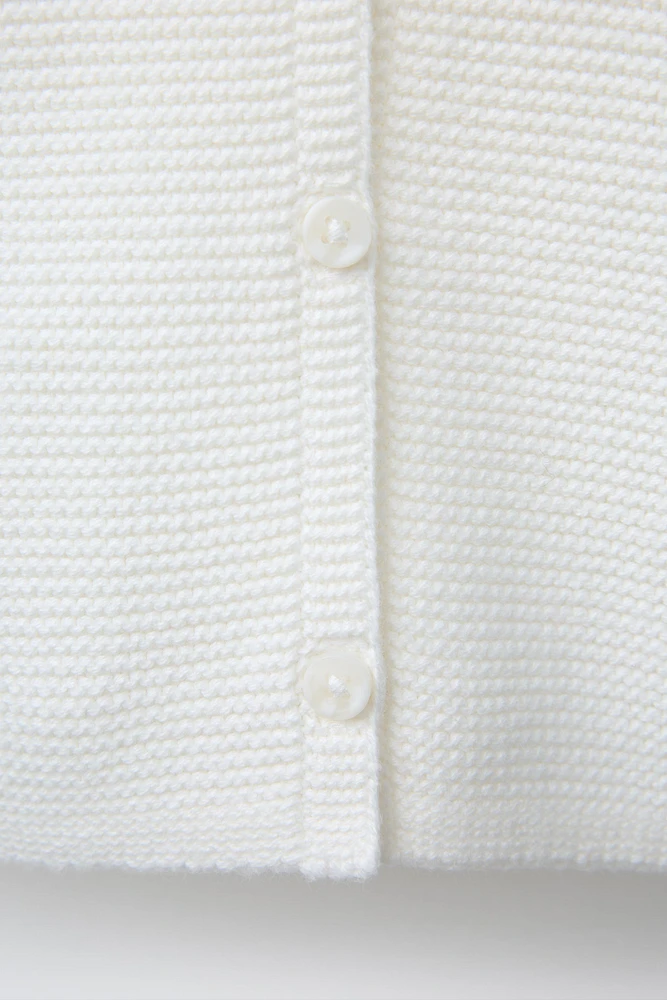 PULL EN MAILLE AVEC POCHE