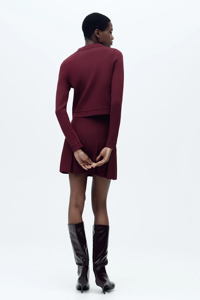 GILET EN MAILLE À BOUTON DORÉ