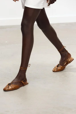 LEATHER TIED CAGE SANDALS