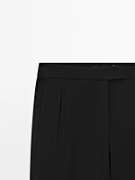 Pantalon avec boutons dans le bas