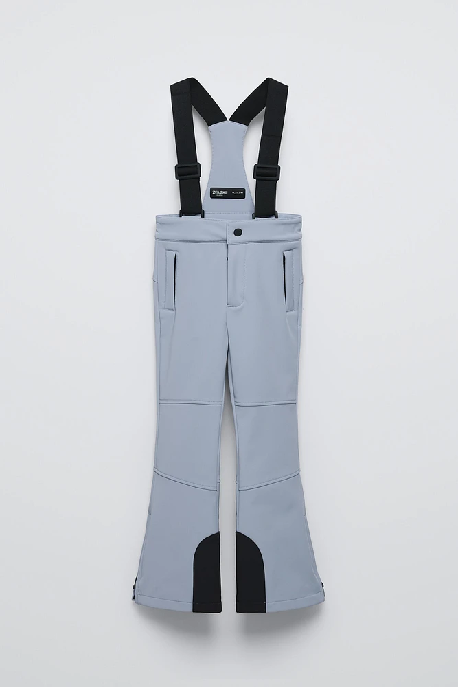 PANTALON À BRETELLES COUPE-VENT ET DÉPERLANT RECCO® SYSTEM SKI COLLECTION