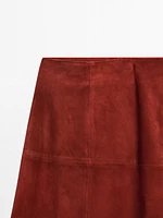 Jupe midi évasée en cuir finition daim