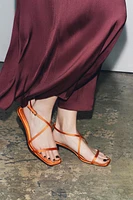 SATIN-EFFECT CROSSED STRAP SANDALS