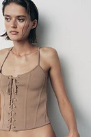 CORSET EN MAILLE À LACETS