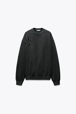 SWEAT OVERSIZE À DÉCHIRURES