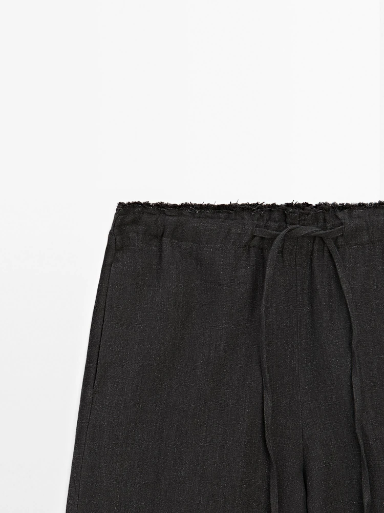 Linen suit trousers with frayed detail