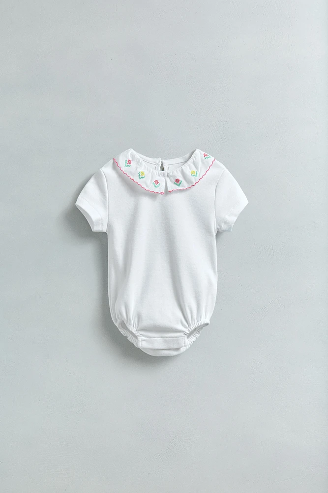 EMBROIDERED NECK BODYSUIT