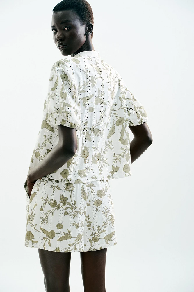 PRINTED TOP WITH EMBROIDERED EYELETS