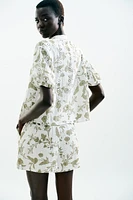 PRINTED TOP WITH EMBROIDERED EYELETS