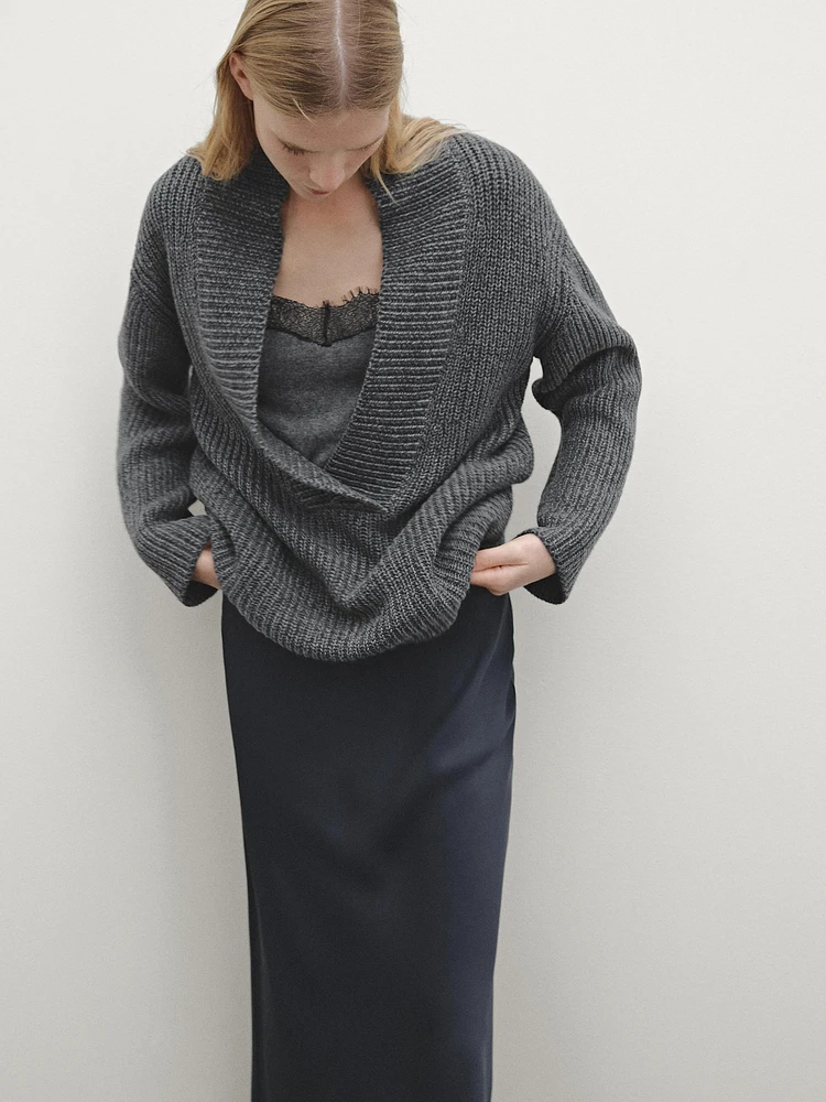 Pull en maille perlée à col effiloché