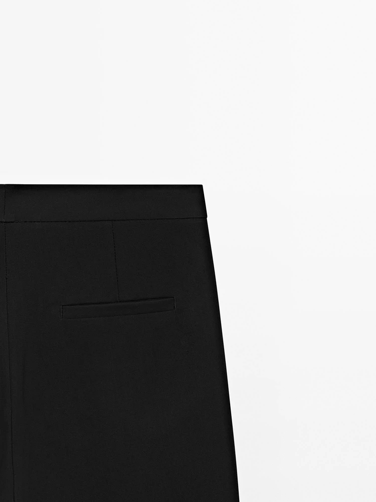 Pantalon avec boutons dans le bas