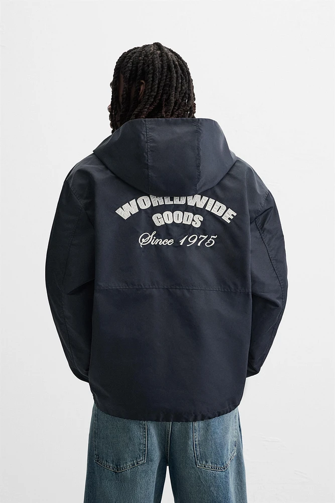 BLOUSON TECHNIQUE À CAPUCHE