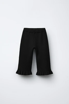 PANTALON EN MAILLE AVEC VOLANTS
