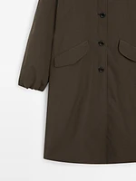 Technical fabric trench coat with button detail