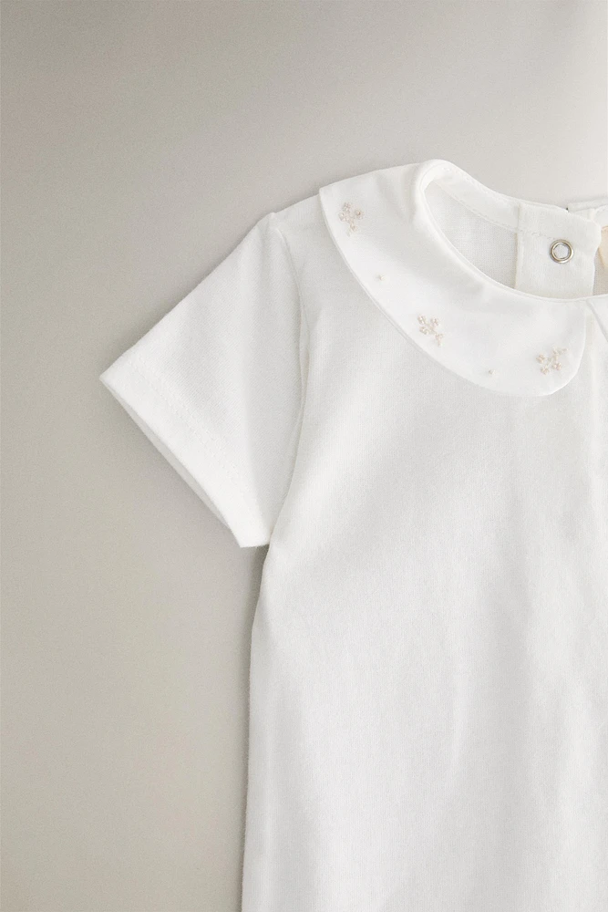 CHILDREN'S BODYSUIT WITH FLORAL EMBROIDERY
