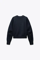 PLEATED SLEEVE SWEATSHIRT
