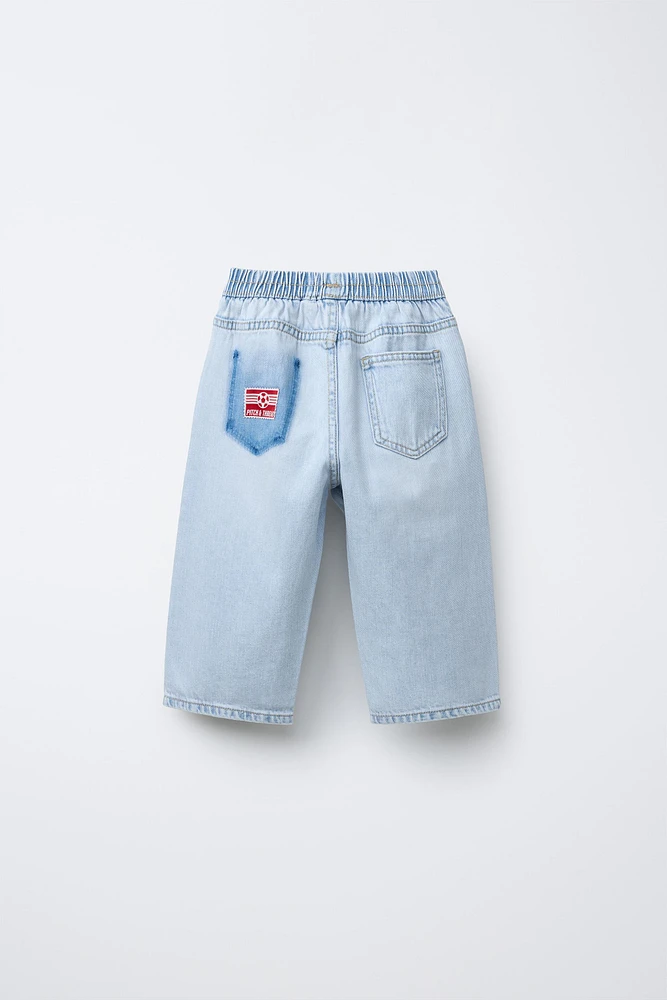JEAN WIDE LEG À PIÈCES