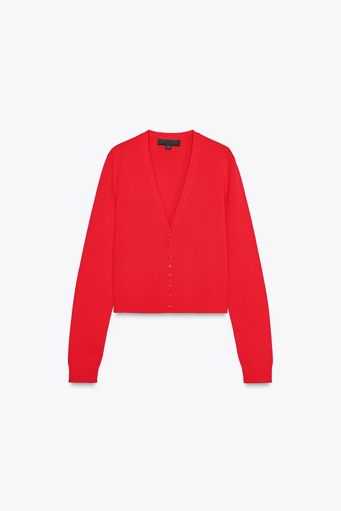 GILET EN MAILLE À LISERÉS LATÉRAUX