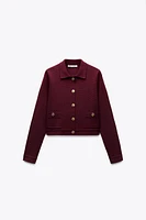 GILET EN MAILLE À BOUTON DORÉ