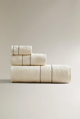 BATH TOWEL WITH BACKSTITCH BORDER