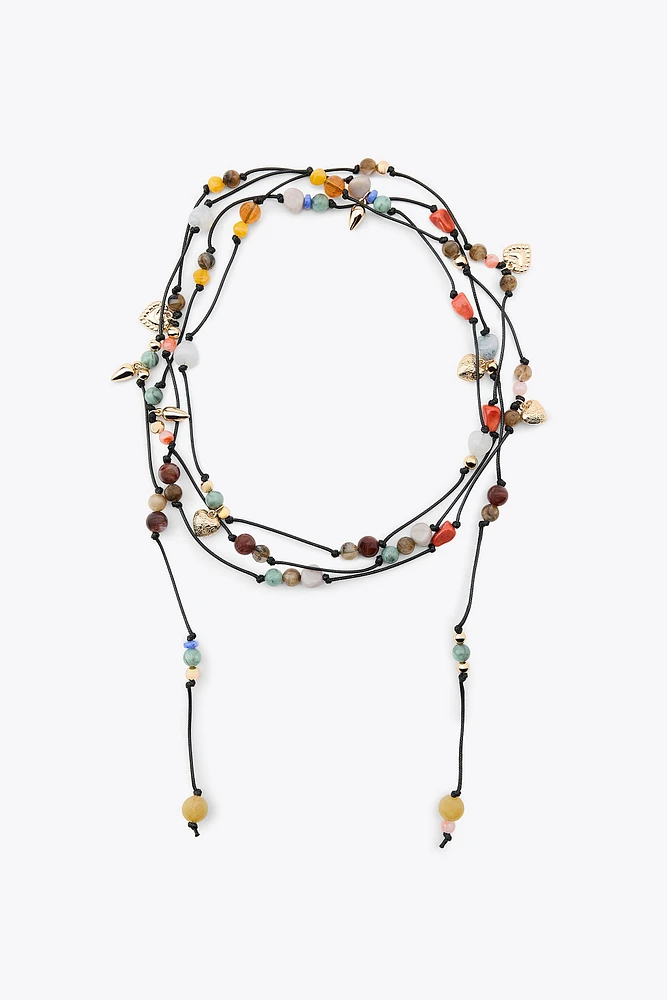 MULTI-POSITION BEADED CORD NECKLACE