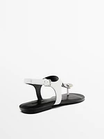 Flat leather sandals with embellished detail
