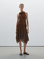 Flowing check skirt with asymmetric hem