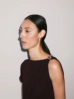 Draped neckline top with brooch detail