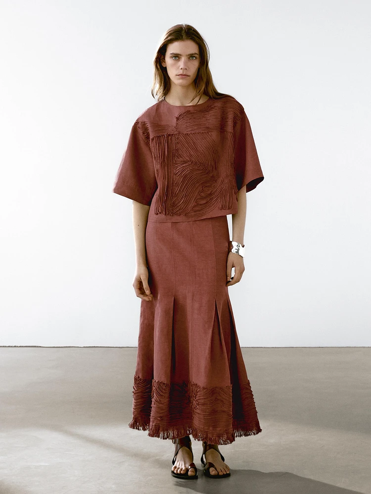Flowing midi skirt with embroidered detail