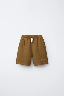 TEXTURED EMBROIDERED SHORTS