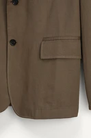 VESTE BOXY FIT COSTUME ÉDITION LIMITÉE
