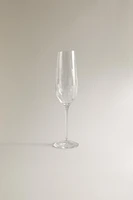 CRYSTALLINE FLUTE GLASS WITH RAISED DESIGN